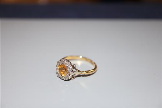 A 19th century 18ct, citrine and round cut diamond set cluster ring, size R, gross 4.4 grams.